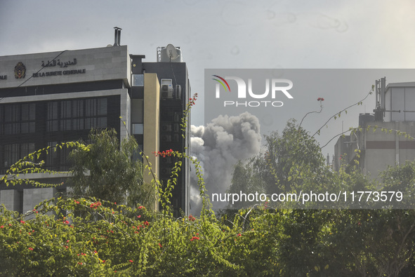 Smoke rises among the residential buildings following an Israeli attack on Ghobeiry municipality located in the Dahieh region in Beirut, Leb...