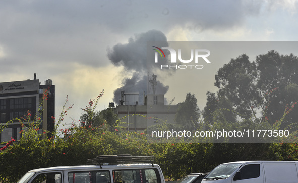 Smoke rises among the residential buildings following an Israeli attack on Ghobeiry municipality located in the Dahieh region in Beirut, Leb...