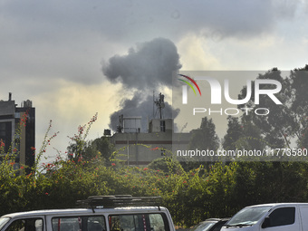 Smoke rises among the residential buildings following an Israeli attack on Ghobeiry municipality located in the Dahieh region in Beirut, Leb...