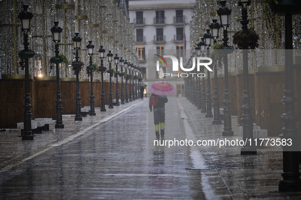 Heavy rainfall leads to significant flooding in various parts of Malaga, including major streets and public areas. 