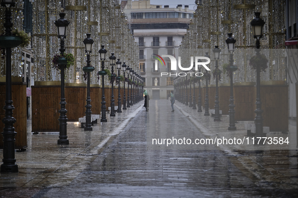 Heavy rainfall leads to significant flooding in various parts of Malaga, including major streets and public areas. 