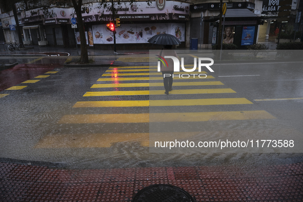 Heavy rainfall leads to significant flooding in various parts of Malaga, including major streets and public areas. 