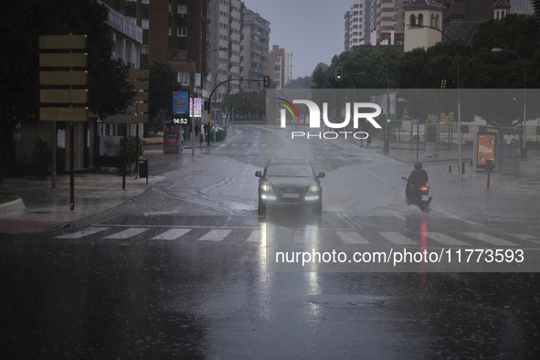 Heavy rainfall leads to significant flooding in various parts of Malaga, including major streets and public areas. 