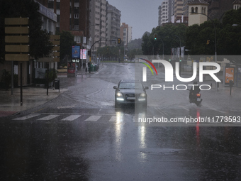 Heavy rainfall leads to significant flooding in various parts of Malaga, including major streets and public areas. (