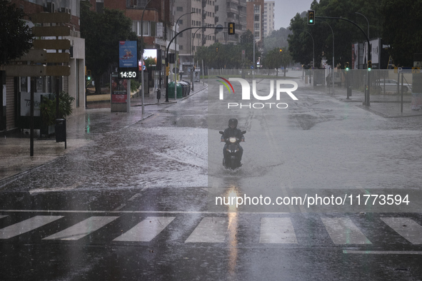 Heavy rainfall leads to significant flooding in various parts of Malaga, including major streets and public areas. 