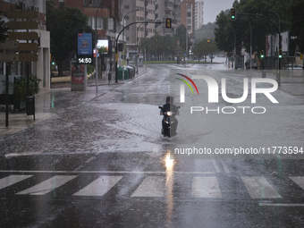 Heavy rainfall leads to significant flooding in various parts of Malaga, including major streets and public areas. (