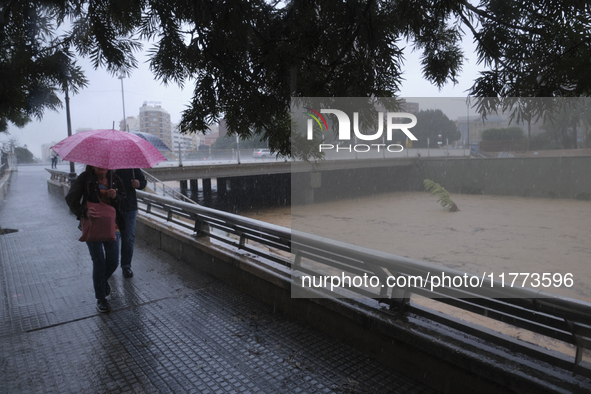 Heavy rainfall leads to significant flooding in various parts of Malaga, including major streets and public areas. 