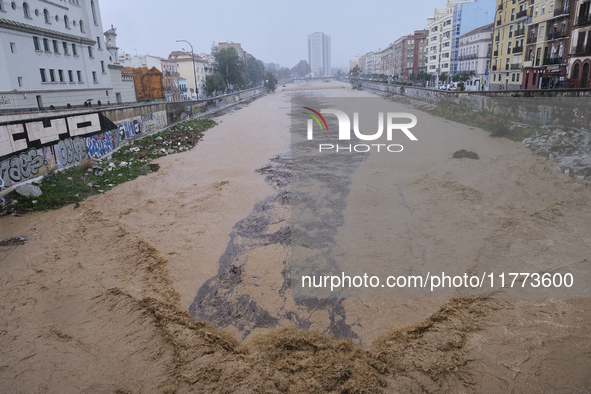 Heavy rainfall leads to significant flooding in various parts of Malaga, including major streets and public areas. 