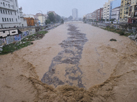 Heavy rainfall leads to significant flooding in various parts of Malaga, including major streets and public areas. (