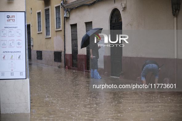 Heavy rainfall leads to significant flooding in various parts of Malaga, including major streets and public areas. 