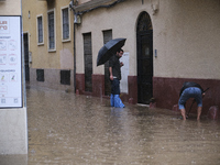 Heavy rainfall leads to significant flooding in various parts of Malaga, including major streets and public areas. (