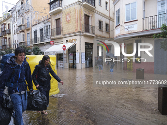 Heavy rainfall leads to significant flooding in various parts of Malaga, including major streets and public areas. (