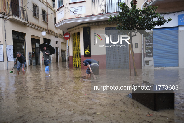 Heavy rainfall leads to significant flooding in various parts of Malaga, including major streets and public areas. 