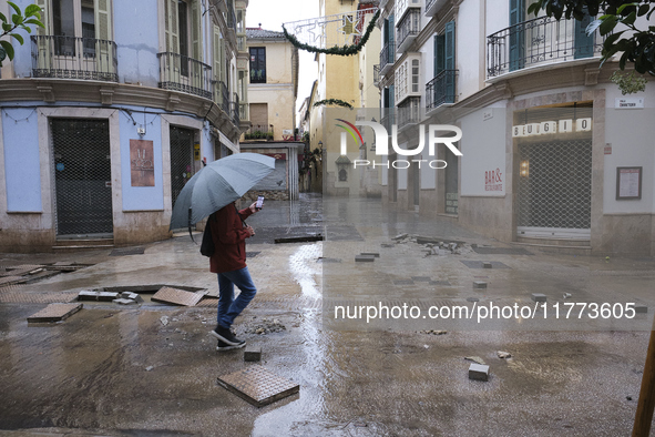 Heavy rainfall leads to significant flooding in various parts of Malaga, including major streets and public areas. 