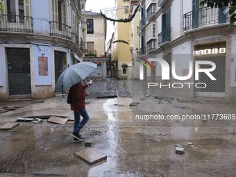 Heavy rainfall leads to significant flooding in various parts of Malaga, including major streets and public areas. (