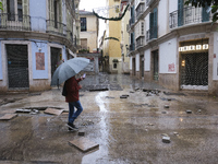 Heavy rainfall leads to significant flooding in various parts of Malaga, including major streets and public areas. (