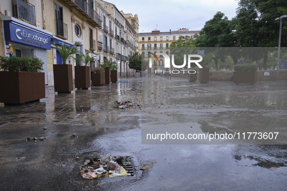 Heavy rainfall leads to significant flooding in various parts of Malaga, including major streets and public areas. 