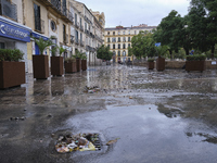 Heavy rainfall leads to significant flooding in various parts of Malaga, including major streets and public areas. (