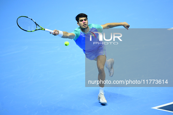 Carlos Alcaraz competes during the Nitto ATP Finals 2024 Group B match against Andrej Rublev at Inalpi Arena in Milan, Italy, on November 13...