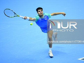 Carlos Alcaraz competes during the Nitto ATP Finals 2024 Group B match against Andrej Rublev at Inalpi Arena in Milan, Italy, on November 13...