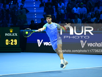 Carlos Alcaraz competes during the Nitto ATP Finals 2024 Group B match against Andrej Rublev at Inalpi Arena in Milan, Italy, on November 13...