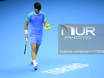 Carlos Alcaraz competes during the Nitto ATP Finals 2024 Group B match against Andrej Rublev at Inalpi Arena in Milan, Italy, on November 13...