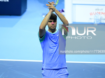 Carlos Alcaraz competes during the Nitto ATP Finals 2024 Group B match against Andrej Rublev at Inalpi Arena in Milan, Italy, on November 13...