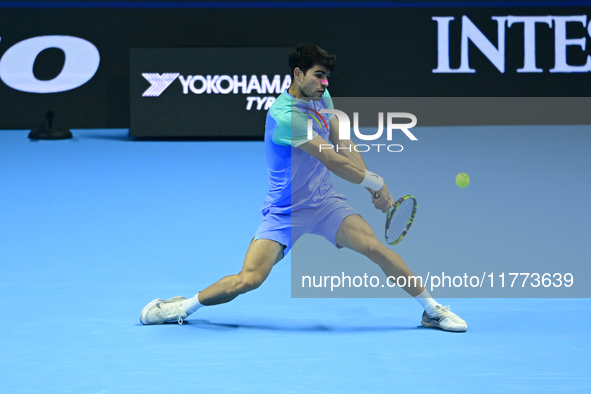 Carlos Alcaraz competes during the Nitto ATP Finals 2024 Group B match against Andrej Rublev at Inalpi Arena in Milan, Italy, on November 13...