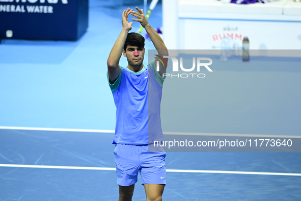 Carlos Alcaraz competes during the Nitto ATP Finals 2024 Group B match against Andrej Rublev at Inalpi Arena in Milan, Italy, on November 13...