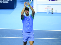 Carlos Alcaraz competes during the Nitto ATP Finals 2024 Group B match against Andrej Rublev at Inalpi Arena in Milan, Italy, on November 13...