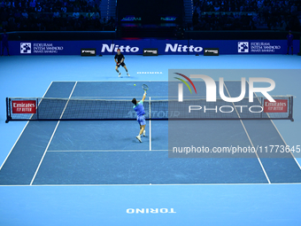 Andrej Rublev and Carlos Alcaraz play during the Nitto ATP Finals 2024 Group B match at Inalpi Arena in Milan, Italy, on November 13, 2024....