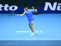 Carlos Alcaraz competes during the Nitto ATP Finals 2024 Group B match against Andrej Rublev at Inalpi Arena in Milan, Italy, on November 13...