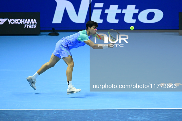 Carlos Alcaraz competes during the Nitto ATP Finals 2024 Group B match against Andrej Rublev at Inalpi Arena in Milan, Italy, on November 13...