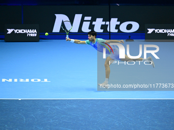 Carlos Alcaraz competes during the Nitto ATP Finals 2024 Group B match against Andrej Rublev at Inalpi Arena in Milan, Italy, on November 13...