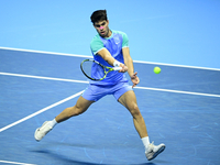 Carlos Alcaraz competes during the Nitto ATP Finals 2024 Group B match against Andrej Rublev at Inalpi Arena in Milan, Italy, on November 13...