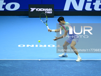 Carlos Alcaraz competes during the Nitto ATP Finals 2024 Group B match against Andrej Rublev at Inalpi Arena in Milan, Italy, on November 13...