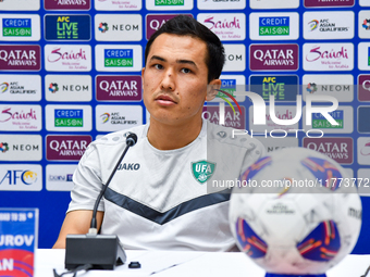 Uzbekistan player Otabek Shukurov attends a press conference at Jassim Bin Hamad Stadium in Doha, Qatar, on November 13, 2024, ahead of the...