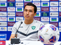 Uzbekistan player Otabek Shukurov attends a press conference at Jassim Bin Hamad Stadium in Doha, Qatar, on November 13, 2024, ahead of the...