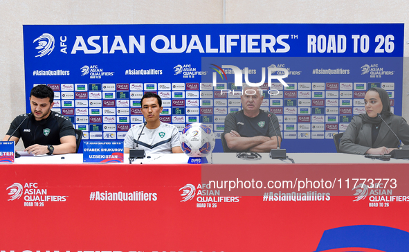 Uzbekistan national team assistant coach Vlado Radmanovich (2nd R) and player Otabek Shukurov (2nd L) attend a press conference at Jassim Bi...