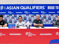 Uzbekistan national team assistant coach Vlado Radmanovich (2nd R) and player Otabek Shukurov (2nd L) attend a press conference at Jassim Bi...