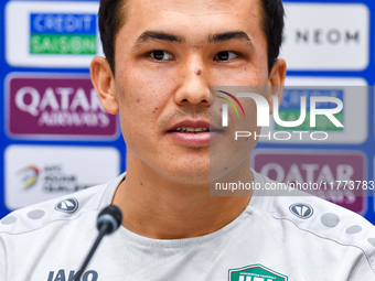 Uzbekistan player Otabek Shukurov attends a press conference at Jassim Bin Hamad Stadium in Doha, Qatar, on November 13, 2024, ahead of the...