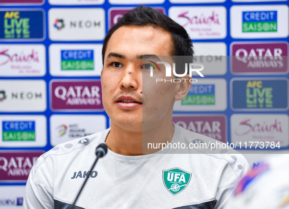 Uzbekistan player Otabek Shukurov attends a press conference at Jassim Bin Hamad Stadium in Doha, Qatar, on November 13, 2024, ahead of the...