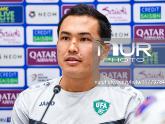 Uzbekistan player Otabek Shukurov attends a press conference at Jassim Bin Hamad Stadium in Doha, Qatar, on November 13, 2024, ahead of the...