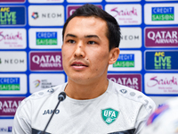 Uzbekistan player Otabek Shukurov attends a press conference at Jassim Bin Hamad Stadium in Doha, Qatar, on November 13, 2024, ahead of the...