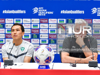 Uzbekistan national team assistant coach Vlado Radmanovich (R) and player Otabek Shukurov (L) attend a press conference at Jassim Bin Hamad...