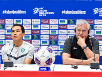 Uzbekistan national team assistant coach Vlado Radmanovich (R) and player Otabek Shukurov (L) attend a press conference at Jassim Bin Hamad...