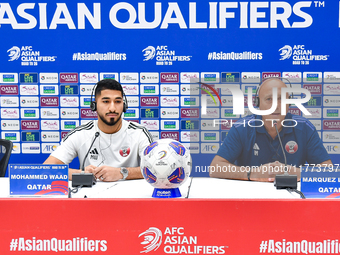 Qatar national team head coach Marquez Lopez (R) and player Mohammed Waad (L) attend a press conference at Jassim Bin Hamad Stadium in Doha,...