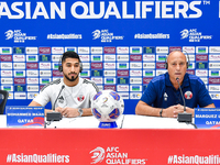 Qatar national team head coach Marquez Lopez (R) and player Mohammed Waad (L) attend a press conference at Jassim Bin Hamad Stadium in Doha,...