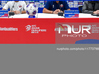 Qatar national team head coach Marquez Lopez (second from right) and player Mohammed Waad (left) attend a press conference at Jassim Bin Ham...