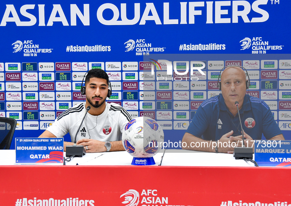 Qatar national team head coach Marquez Lopez (R) and player Mohammed Waad (L) attend a press conference at Jassim Bin Hamad Stadium in Doha,...